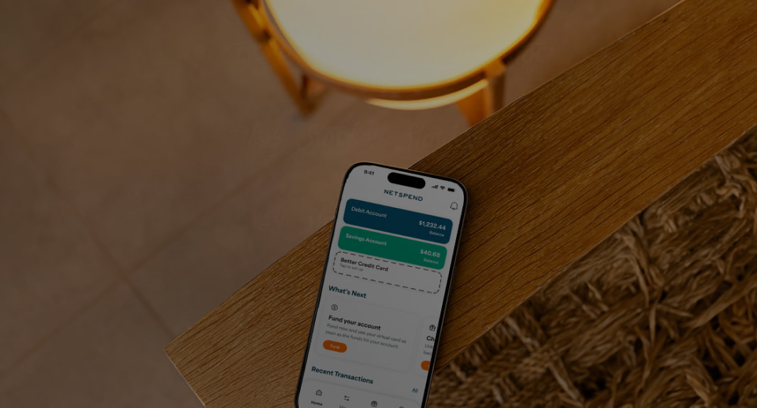 IPhone on a table displaying the Netspend Wallet App